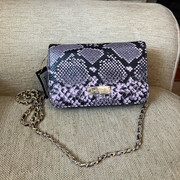 bebe Handbags - Bebe purple snakeskin crossbody purse with chain strap